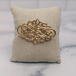 Gold plated ornate design brooch